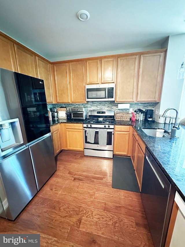 135A Equestrian Row, Bensalem, PA 19020 - kitchen with appliances with stainless steel finishes, a sink, light wood-style flooring, and light brown cabinetry