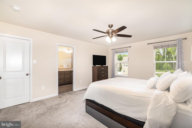 1018 Edenberry Way, Glen Burnie, MD 21060 - bedroom with light colored carpet, baseboards, ensuite bathroom, and a ceiling fan