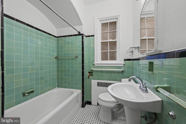 4036 Roland Ave, Baltimore, MD 21211 - bathroom with radiator heating unit, tile walls, toilet, bathtub / shower combination, and wainscoting