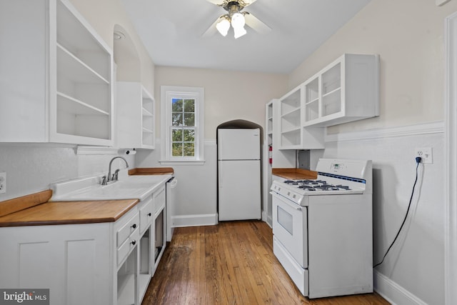 4036 Roland Ave, Baltimore, MD 21211 - kitchen featuring white appliances, open shelves, a sink, and baseboards