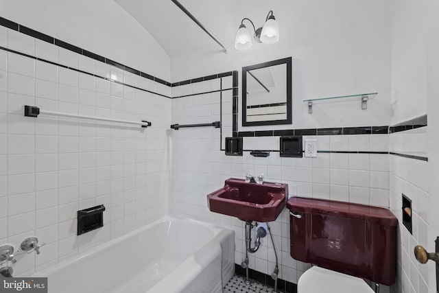 4036 Roland Ave, Baltimore, MD 21211 - full bath featuring tile walls, toilet, a sink, shower / washtub combination, and wainscoting