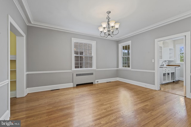 4036 Roland Ave, Baltimore, MD 21211 - unfurnished dining area featuring radiator, a chandelier, light wood-type flooring, ornamental molding, and baseboards