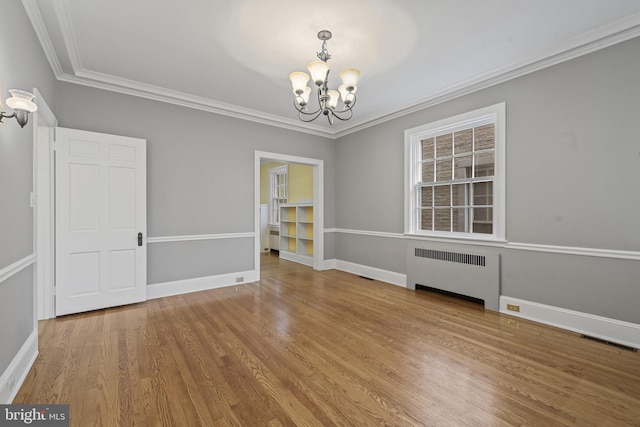 4036 Roland Ave, Baltimore, MD 21211 - unfurnished room with radiator, a chandelier, wood finished floors, ornamental molding, and baseboards