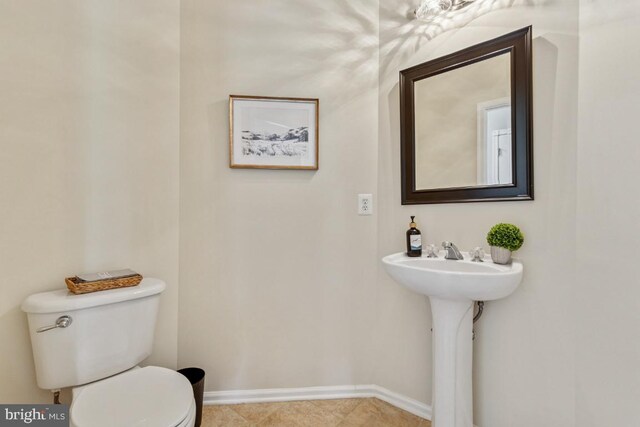 43229 Augustine Pl, Ashburn, VA 20147 - half bath with toilet, baseboards, a sink, and tile patterned floors