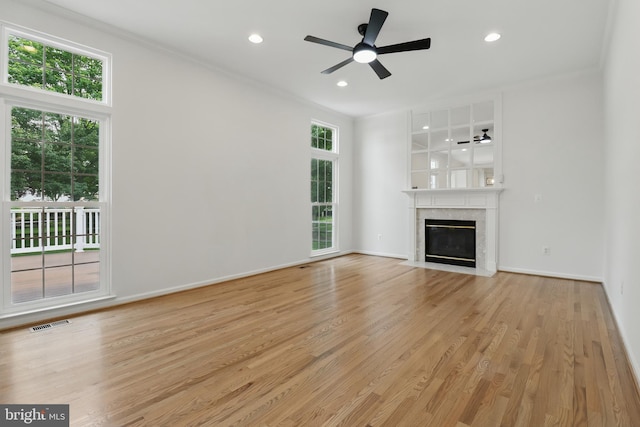 43175 Burstall Ct, Leesburg, VA 20176 - unfurnished living room with light wood-style floors, crown molding, a ceiling fan, recessed lighting, and a premium fireplace