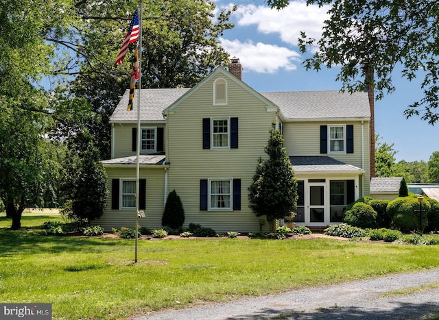27843 Saint Michaels Rd, Easton, MD 21601 - view of front of house featuring a chimney, a front yard, and roof with shingles