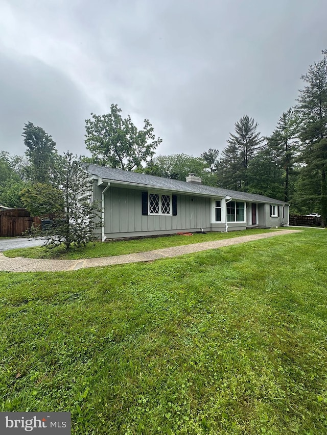 14 Hillspring Rd, Chadds Ford, PA 19317 - view of front of house with board and batten siding and a chimney