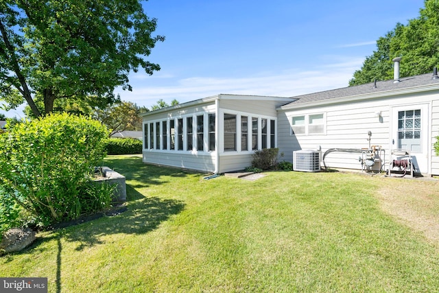 10004 Farrar Ct, Cheltenham, MD 20623 - rear view of house with central AC unit and a lawn