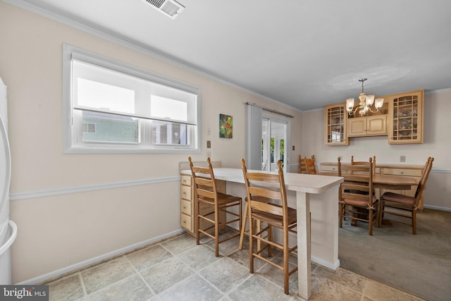 10004 Farrar Ct, Cheltenham, MD 20623 - dining space featuring a chandelier, crown molding, baseboards, and light stone finish flooring