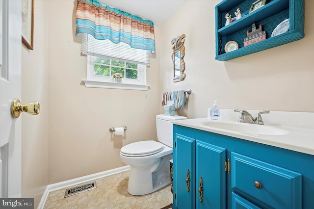 1004 Truman Rd, East Norriton, PA 19403 - half bathroom with vanity, toilet, baseboards, and tile patterned flooring