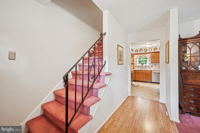 1004 Truman Rd, East Norriton, PA 19403 - stairway featuring wood finished floors and baseboards