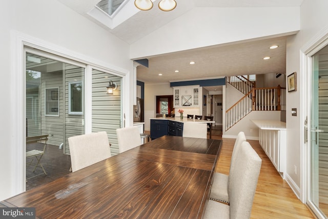 8 Lochwell Ct, Baltimore, MD 21234 - dining area featuring stairway, vaulted ceiling, light wood-type flooring, a skylight, and recessed lighting