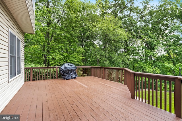 8 Lochwell Ct, Baltimore, MD 21234 - wooden deck featuring a grill and view of wooded area