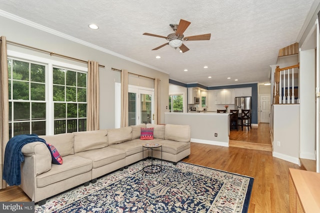 8 Lochwell Ct, Baltimore, MD 21234 - living room featuring a textured ceiling, ceiling fan, light wood-type flooring, ornamental molding, and recessed lighting