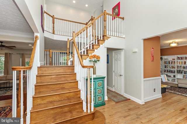 8 Lochwell Ct, Baltimore, MD 21234 - stairs with wood finished floors, ceiling fan, and recessed lighting