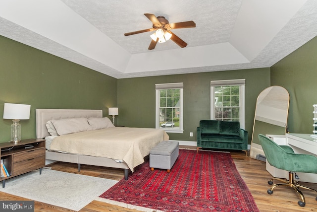 8 Lochwell Ct, Baltimore, MD 21234 - bedroom featuring a tray ceiling, wood finished floors, a textured ceiling, baseboards, and a ceiling fan