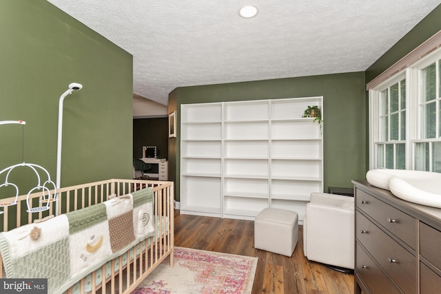 8 Lochwell Ct, Baltimore, MD 21234 - bedroom featuring dark wood-style floors and a textured ceiling