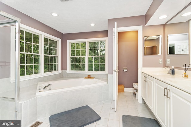 8 Lochwell Ct, Baltimore, MD 21234 - full bath with toilet, a garden tub, double vanity, tile patterned floors, and recessed lighting