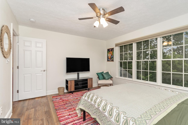 8 Lochwell Ct, Baltimore, MD 21234 - bedroom featuring wood-type flooring, a textured ceiling, baseboards, and ceiling fan