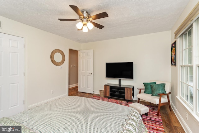 8 Lochwell Ct, Baltimore, MD 21234 - bedroom featuring wood finished floors, baseboards, multiple windows, a textured ceiling, and ceiling fan