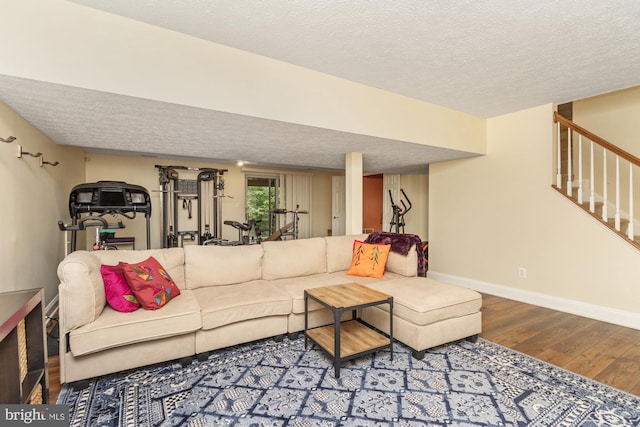 8 Lochwell Ct, Baltimore, MD 21234 - living room featuring wood finished floors, a textured ceiling, stairway, and baseboards