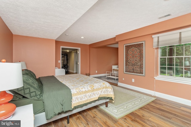 8 Lochwell Ct, Baltimore, MD 21234 - bedroom with baseboards, wood finished floors, a textured ceiling, and recessed lighting