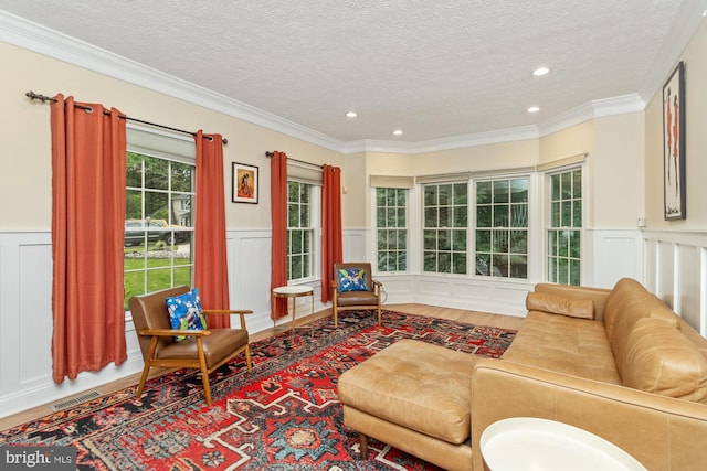 8 Lochwell Ct, Baltimore, MD 21234 - living area featuring a textured ceiling, wainscoting, and wood finished floors