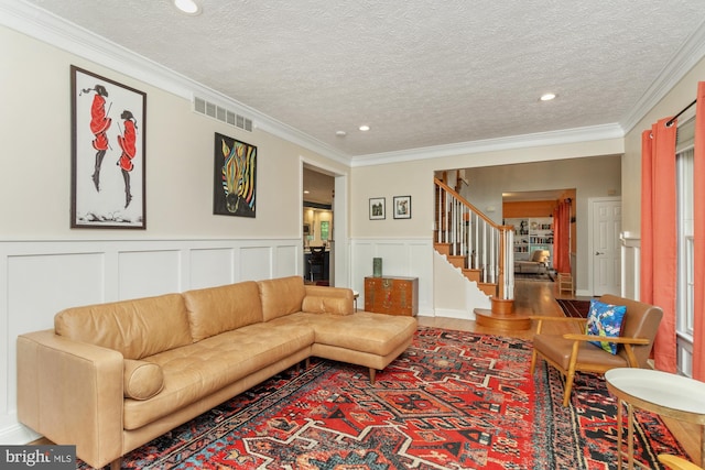 8 Lochwell Ct, Baltimore, MD 21234 - living room featuring stairway, recessed lighting, wood finished floors, ornamental molding, and a textured ceiling
