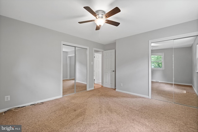 13712 S Springfield Rd, Brandywine, MD 20613 - unfurnished bedroom featuring carpet floors, baseboards, two closets, and a ceiling fan