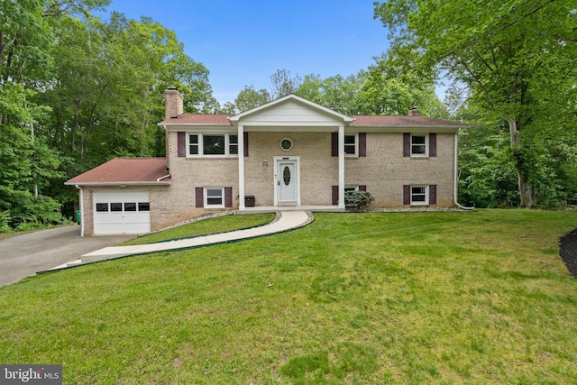 13712 S Springfield Rd, Brandywine, MD 20613 - split foyer home featuring a chimney, brick siding, driveway, and a garage