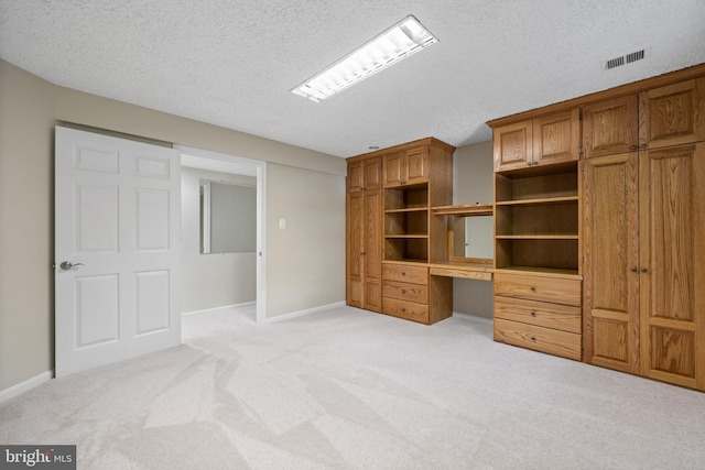 13712 S Springfield Rd, Brandywine, MD 20613 - unfurnished bedroom with light carpet, a textured ceiling, and baseboards