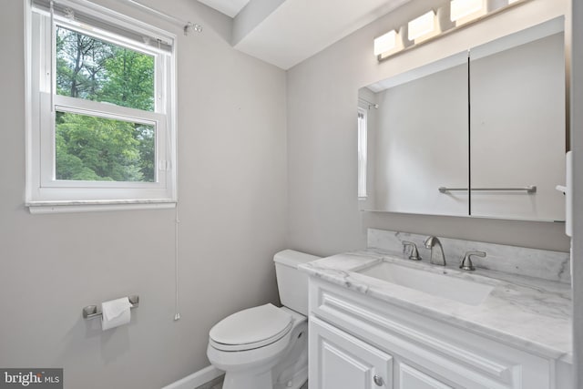 13712 S Springfield Rd, Brandywine, MD 20613 - bathroom with toilet, vanity, and baseboards