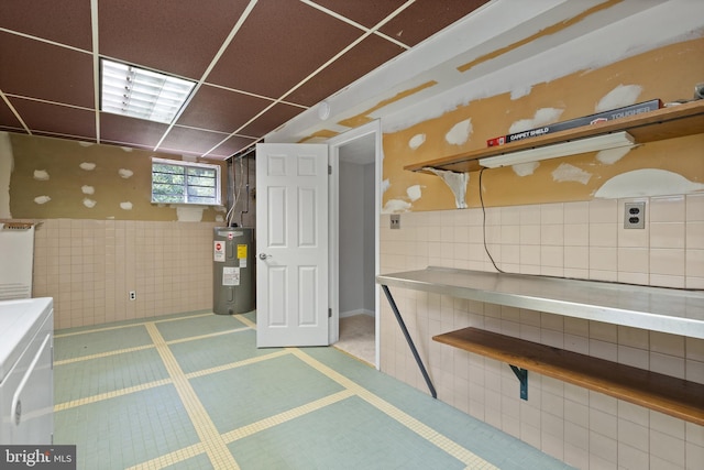 13712 S Springfield Rd, Brandywine, MD 20613 - miscellaneous room with electric water heater, washer / clothes dryer, and tile walls