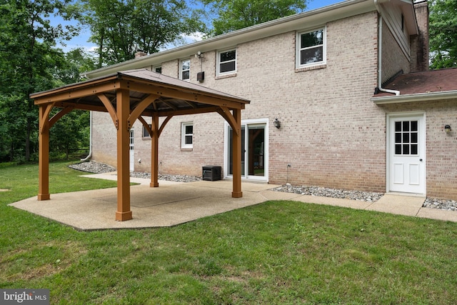 13712 S Springfield Rd, Brandywine, MD 20613 - back of house featuring a chimney, a yard, a gazebo, and brick siding