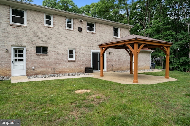 13712 S Springfield Rd, Brandywine, MD 20613 - back of house with a gazebo, a patio area, a lawn, and brick siding