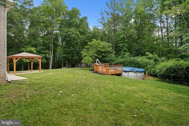 13712 S Springfield Rd, Brandywine, MD 20613 - view of grassy yard featuring a gazebo, a covered pool, a deck, and a forest view