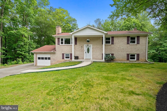 13712 S Springfield Rd, Brandywine, MD 20613 - bi-level home with a chimney, brick siding, and concrete driveway