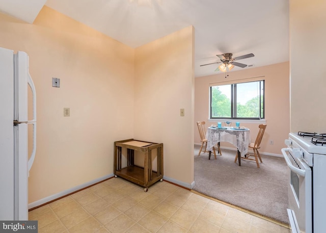 6017 Majors Ln Unit 3, Columbia, MD 21045 - kitchen with white appliances, a ceiling fan, baseboards, and light carpet