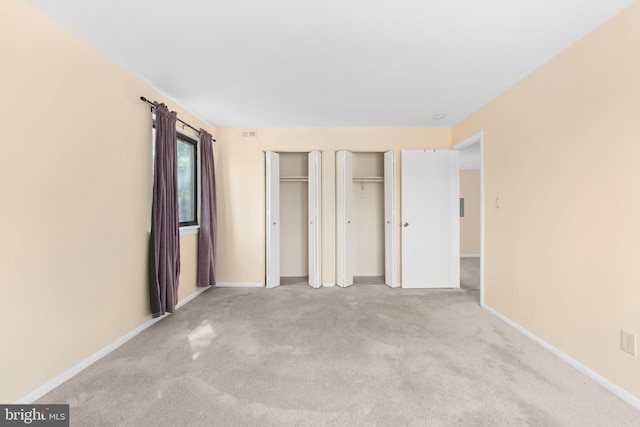 6017 Majors Ln Unit 3, Columbia, MD 21045 - unfurnished bedroom featuring multiple closets and carpet