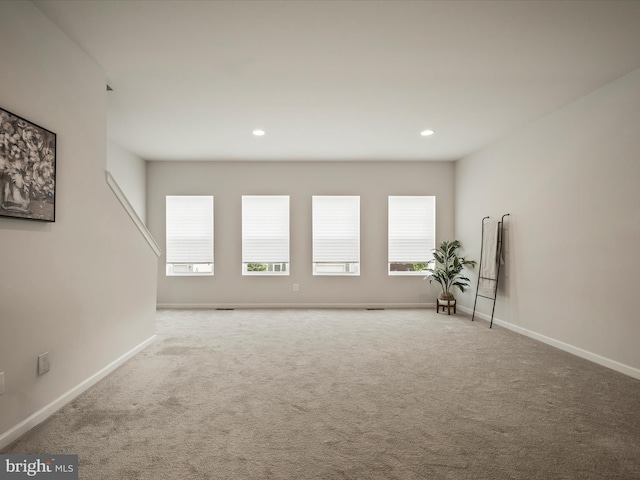262 Norland Knoll Dr, Stephenson, VA 22656 - carpeted empty room featuring plenty of natural light and recessed lighting