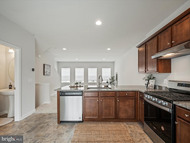 262 Norland Knoll Dr, Stephenson, VA 22656 - kitchen featuring appliances with stainless steel finishes, under cabinet range hood, a peninsula, stone countertops, and recessed lighting