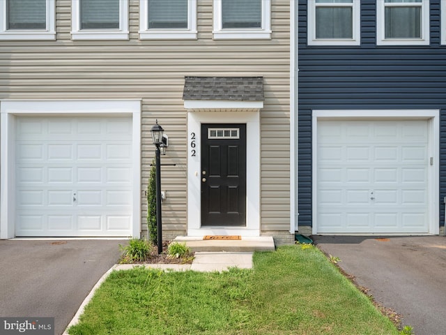 262 Norland Knoll Dr, Stephenson, VA 22656 - doorway to property with an attached garage and asphalt driveway