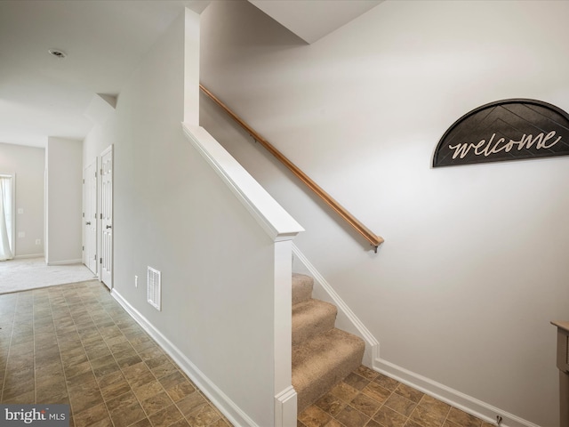 262 Norland Knoll Dr, Stephenson, VA 22656 - stairway featuring stone finish floors