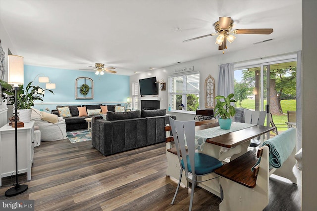 12545 River Run Ln Unit 68, Berlin, MD 21811 - dining space featuring a ceiling fan, wood finished floors, and a fireplace