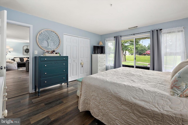 12545 River Run Ln Unit 68, Berlin, MD 21811 - bedroom featuring dark wood-type flooring, a closet, and access to outside