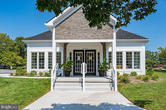 12545 River Run Ln Unit 68, Berlin, MD 21811 - view of front of house with french doors, a front lawn, and roof with shingles