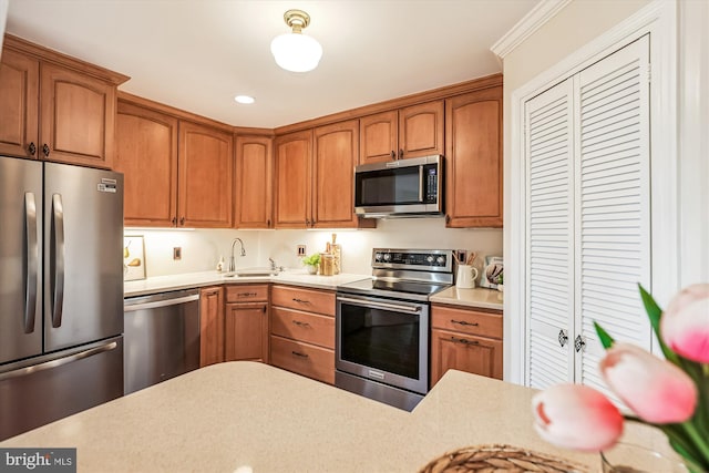 955 26th St NW Unit 512, Washington, DC 20037 - kitchen with stainless steel appliances, light countertops, and brown cabinetry