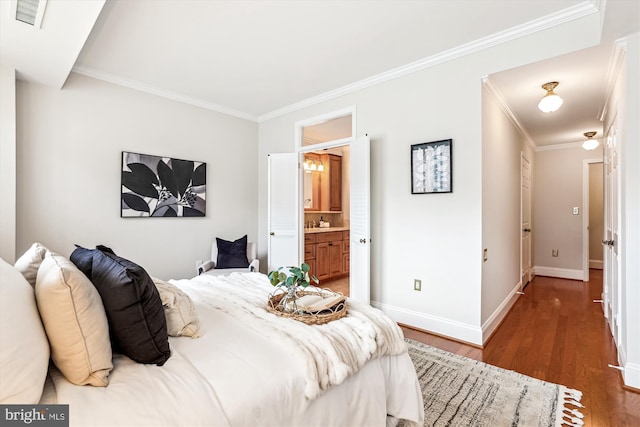 955 26th St NW Unit 512, Washington, DC 20037 - bedroom featuring ornamental molding, wood finished floors, and ensuite bathroom
