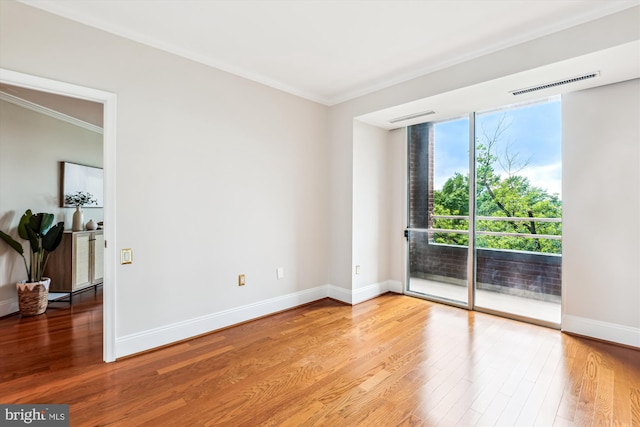 955 26th St NW Unit 512, Washington, DC 20037 - spare room featuring ornamental molding and wood finished floors