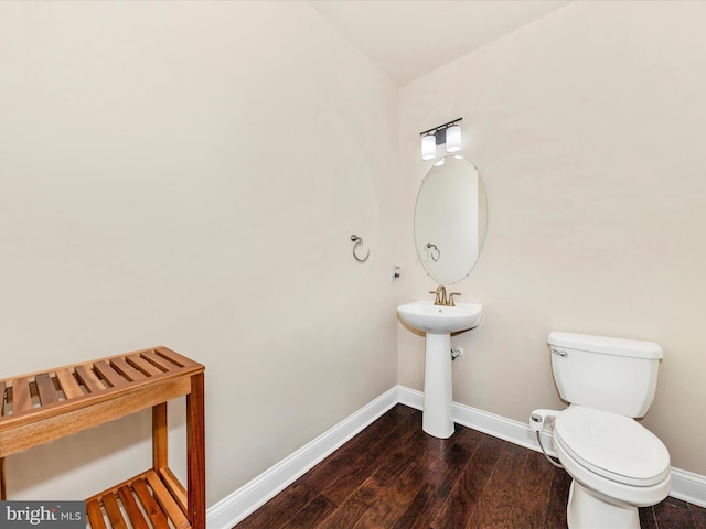 7114 Proclamation Pl, Frederick, MD 21703 - bathroom featuring baseboards, toilet, and wood finished floors